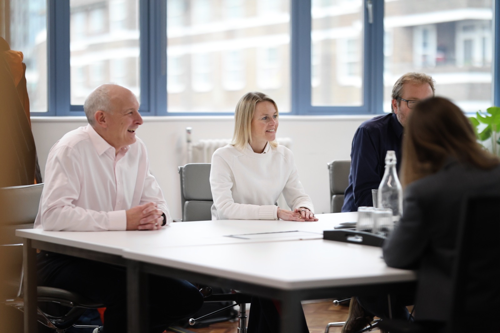 The team laughing together during a workshop